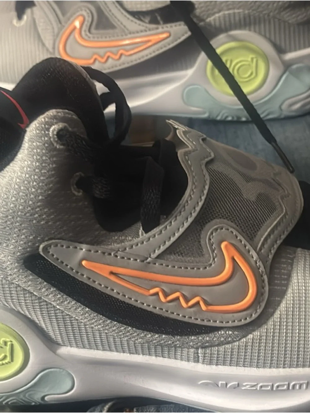 KDs Nike Grey Sneakers with Orange Swoosh and Black Accents